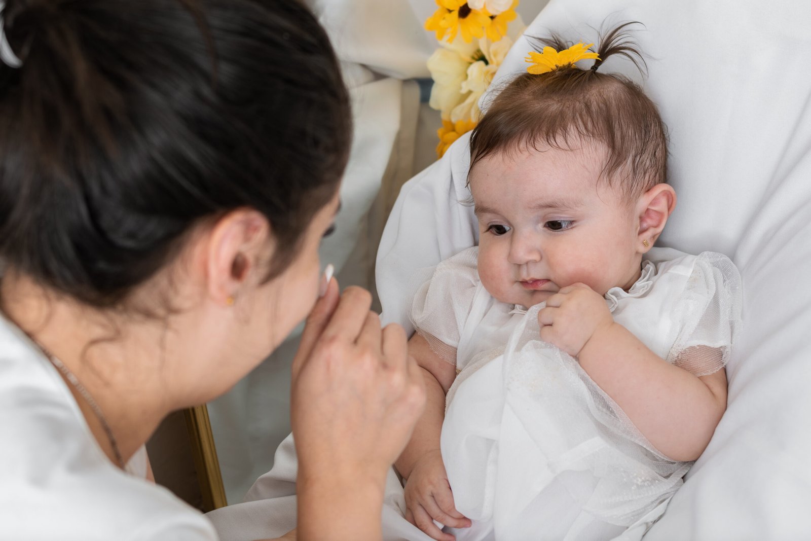 latina-mother-caressing-and-pampering-her-baby-gir-2025-03-09-17-42-06-utc